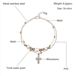 Gold plated stainless steel bracelet with freshwater pearls and a sparkling cross pendant
