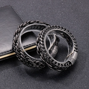 Close-up of vintage punk curb link bracelets in distressed silver finish for men