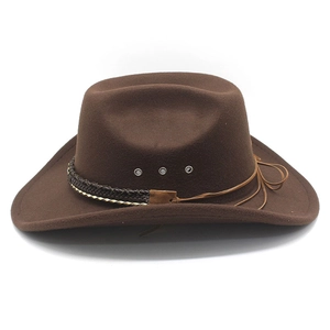 Close-up of brown wool felt cowboy hat with braided band and silver ventilation eyelets