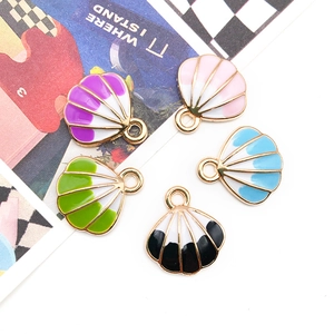 Detail view of five colorful shell-shaped enamel pendants with gold alloy metal frames