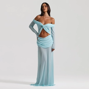Detail of light blue off-shoulder chiffon maxi dress with waist cutout and twist knot