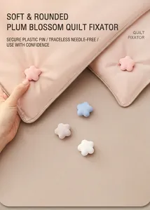 Macro detail of plum blossom quilt clips in pastel colors with needle-free safety design