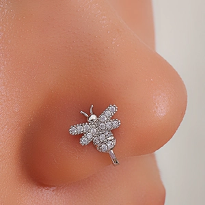 Macro shot of silver bee nose cuff featuring micro-paved cubic zirconia on the nose wing