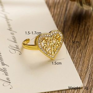 Macro view of gold-plated Tree of Life heart ring showing zircon inlay details