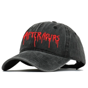 Detailed view of red liquid-style After Hours embroidery on washed cotton baseball cap