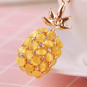 Creative pineapple keychain with yellow cat eye stone and gold-plated alloy finish