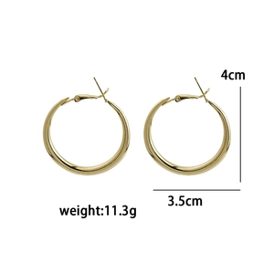 Detailed view of large gold hoop earrings with dimensions 4cm height and 3.5cm width