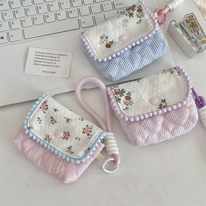 Quilted floral CCD camera case detail with heart buttons and soft cotton texture