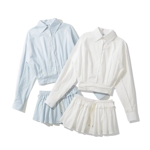 Preppy style two-piece set featuring striped and white cropped shirts and ruffled shorts