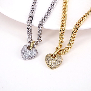 Classic gold and silver heart pendants with micro-paved cubic zirconia on Cuban link chains