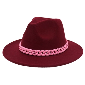 Detail of dark burgundy fedora hat with a pink acrylic thick chain decorative band