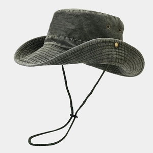 Detailed macro view of olive green washed cotton cowboy hat with metal vent and chin strap