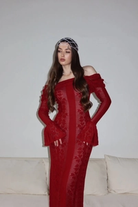 Detail of red hollow knit off-shoulder maxi dress with elegant flare sleeves