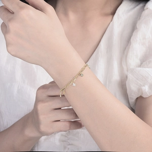 Elegant s925 silver double-layered clover bracelet with gold finish and crystal star charms