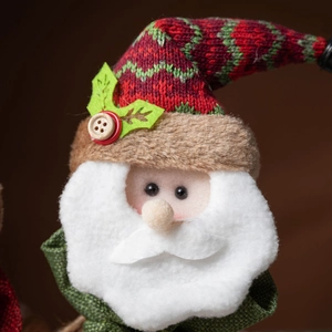 Handcrafted Santa plush Christmas gift bag with knitted hat and wooden button details