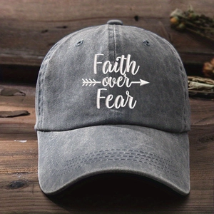 Close-up of Faith over Fear embroidery on vintage washed dark grey baseball cap