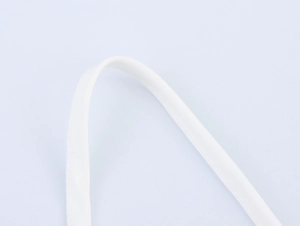 Close-up of white high-density cotton webbing texture for dress straps and bag handles