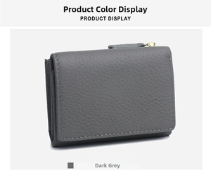Detail of dark grey leather wallet with lychee grain texture and golden zipper