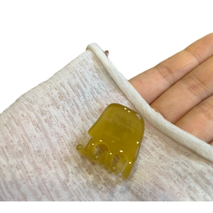 Small amber acetate hair claw clip with gold label handmade for elegant fringe styling
