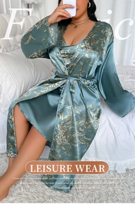 Close-up of floral print satin loungewear set with elegant long-sleeve belted robe
