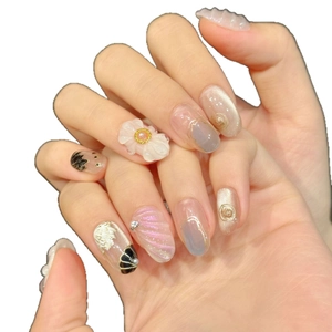 3D floral press-on nails with pink shell texture and gold metal accents for women