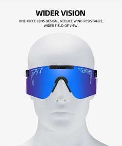 Close-up of cycling goggles with blue-purple gradient lenses and splatter paint frame