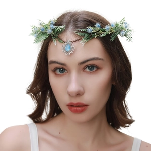 Baroque leaf headband detail featuring vintage silver forehead jewelry with a blue gemstone