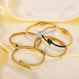 Snake shaped wrap bracelet set with sparkling crystals in gold, silver and black finishes