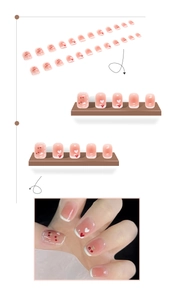 Detailed set of pink press-on nails featuring cherry, heart designs and French tips
