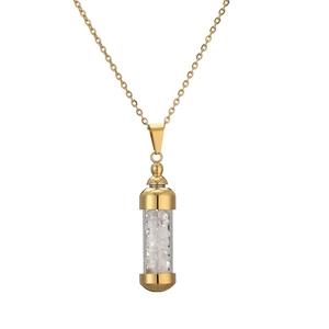 Detailed close-up of a golden perfume bottle pendant necklace with white natural stones