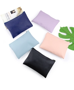 Flat lay of five colorful PU leather pouches in blue, purple, pink and black finishes