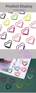 Close-up of colorful heart-shaped paper clips in various vibrant shades and creative design