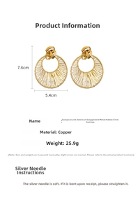 Detailed view of hollow hoop earrings with gold-plated wire texture and silver needle pins