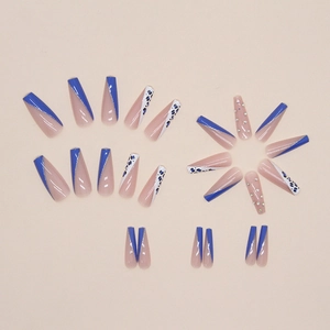 Long ballerina nails with leopard print, blue glitter, and rhinestones in French style