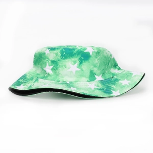 Detailed close-up of green tie-dye bucket hat with star pattern and black lining