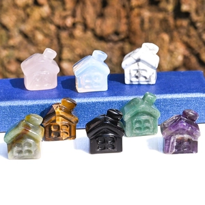 Detailed arrangement of eight house-shaped carvings made from natural healing crystals