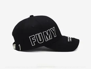 Close-up of vintage black cotton baseball cap with FUMY embroidery and side view detail