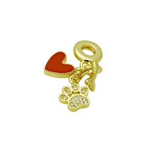 Detailed close-up of a gold-plated red heart charm and sparkling zircon paw print pendant