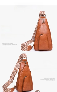 Front and side view of brown lychee grain leather crossbody bag with wave patterned strap