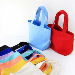 Solid color canvas lunch bag with handles shown in multiple colors on white background