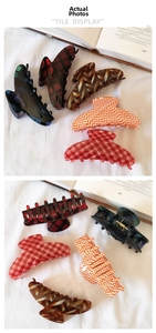 Detailed close-up of large acetate claw clips in various classic plaid and marble patterns