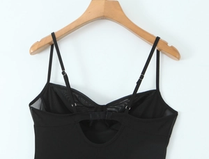 Detail of black chiffon dress back featuring adjustable straps and hook-and-eye closure