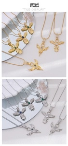 Detailed view of gold and silver phoenix necklaces with cubic zirconia and snake chain