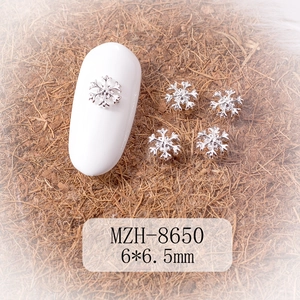 Detailed macro view of 6x6.5mm silver metal snowflake nail art charms model MZH-8650
