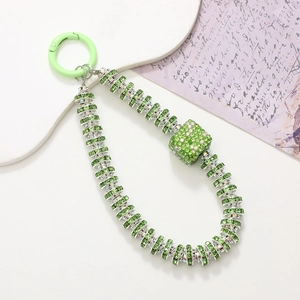 Luxe green rhinestone phone charm with sparkling beaded chain and spring ring clasp