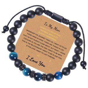 Detail of beaded tiger eye and agate bracelet on Kraft card with English blessing text