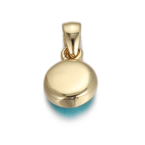 Macro view of a circular gold-plated evil eye pendant with a polished finish on white background