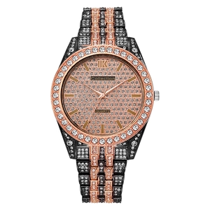 Close-up of rose gold and black quartz watch featuring iced-out rhinestone encrusted dial