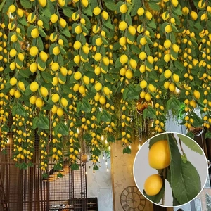 Artificial lemon garland with yellow fruit and green leaves for festive table decoration