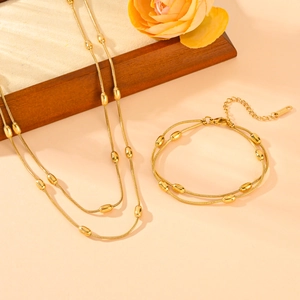 Parure collier et bracelet double rang en acier inoxydable doré avec perles ovales